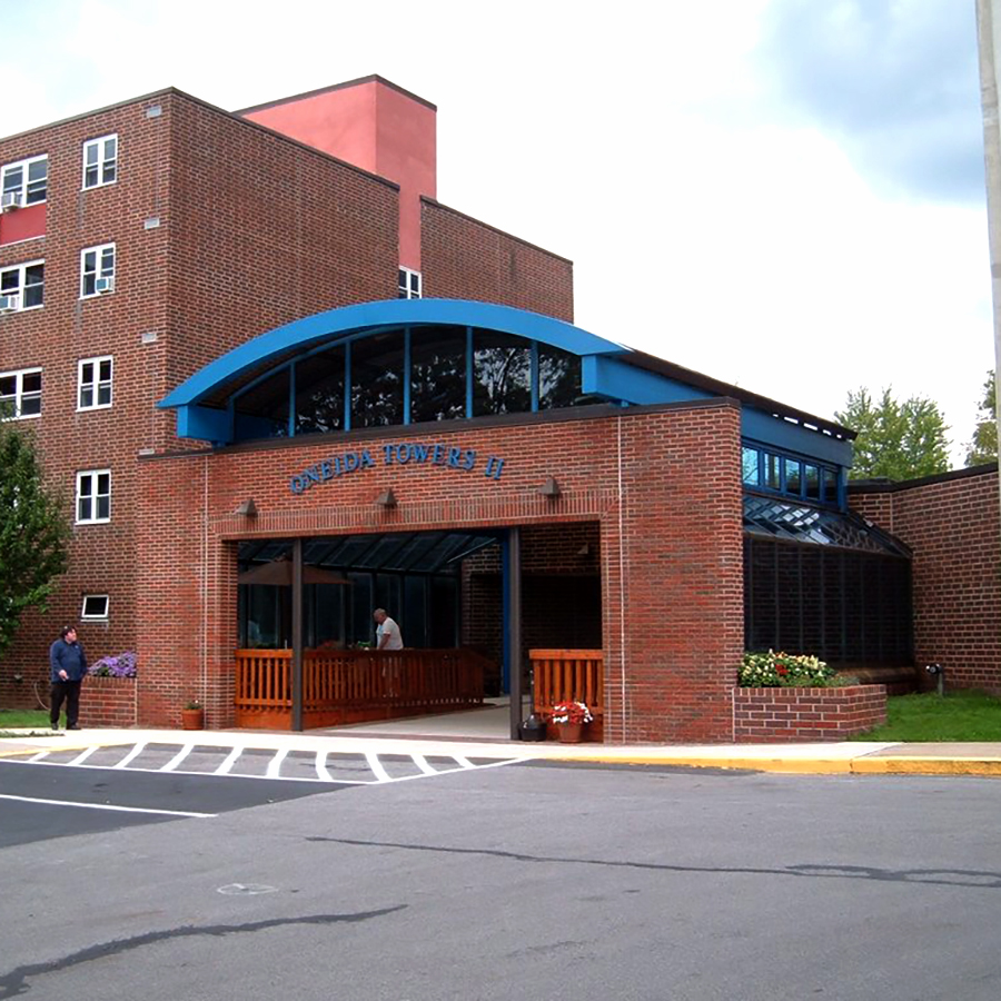 Curved glass canopy Oneida Towers glass canopy